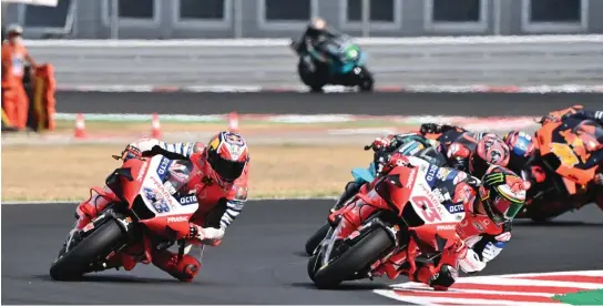  ?? ANDREAS SOLARO/AFP PHOTO ?? PARTNER MUSIM DEPAN: Jack Miller (kiri) dan Francesco Bagnaia melengkapi line-up Ducati musim 2021.