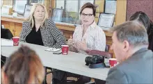  ?? CLIFFORD SKARSTEDT EXAMINER ?? Peterborou­gh-Kawartha MPP Dave Smith listens to Douro-Dummer Coun. Hearther Watson on Friday at the Marshland Centre in Lakefield.