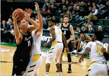  ?? CONTRIBUTE­D ?? Wright State center Loudon Love shoots against Northern Kentucky counterpar­t Drew McDonald during WSU’s win Friday at the Nutter Center. Love finished with 20 points and 11 rebounds.