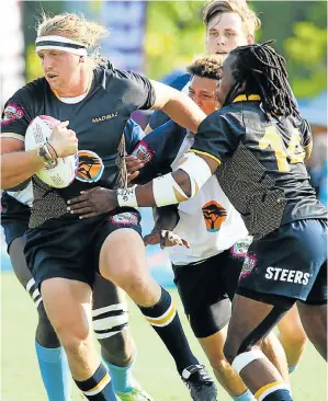  ?? Picture: VAN ZYL NAUDE ?? POWERING THROUGH: Madibaz forward Justin Hollis goes on a drive during their Varsity Cup rugby match against Central University of Technology in Bloemfonte­in on Monday