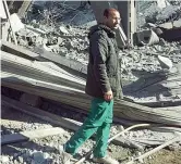  ??  ?? Tra le macerie Alì Mohamed Arif, 35 anni, medico curdo di Kobane. Scappato nel 2012 in Algeria, è tornato a Kobane nel 2014