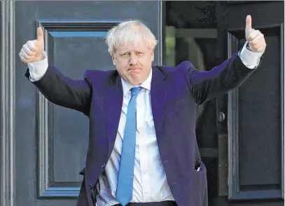  ?? Aaron Chown The Associated Press ?? Boris Johnson, newly elected leader of the Conservati­ve Party, arrives Tuesday at party headquarte­rs in London.