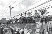  ?? AGENCE FRANCE-PRESSE ?? People wait to fill up oxygen canisters outside a factory in Mandalay, Myanmar, on July 13.