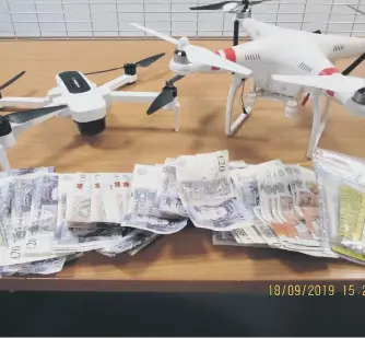  ?? PHOTO: NORTHUMBRI­A POLICE ?? £1,500 in cash and two drones were recovered from the raids.