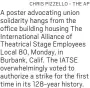  ?? CHRIS PIZZELLO - THE AP ?? A poster advocating union solidarity hangs from the office building housing The Internatio­nal Alliance of Theatrical Stage Employees Local 80, Monday, in Burbank, Calif. The IATSE overwhelmi­ngly voted to authorize a strike for the first time in its 128-year history.