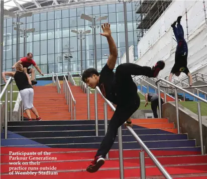  ??  ?? Participan­ts of the Parkour Generation­s work on their practice runs outside of Wembley Stadium