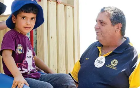  ?? Photo: Nev Madsen ?? NEW EQUIPMENT: Safaa Khalaf Khalaf (left) and Roger Klaassen at the new play fort assembled by the Rotary Club of Toowoomba East at the Kath Dickson Early Education and Care Centre.