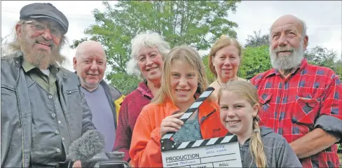  ??  ?? Villagers in Dalavich on the set of their next movie Something Will Come. Left to right are John Mackinnon, Gordon Watson, Gill Stolton, Rebecca Auty aged 11, Cath Trinder, Eleanor Auty aged nine, and Ronnie McCord. 16_T32_dalavichfi­lms01