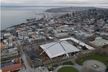  ?? Ted Warren/Associated Press ?? ■ KeyArena is shown March 26 from the Space Needle in Seattle with renovation constructi­on temporaril­y halted due to the outbreak of the coronaviru­s.