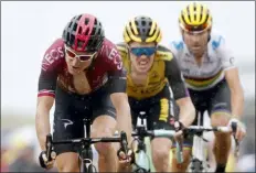  ?? CHRISTOPHE ENA — THE ASSOCIATED PRESS ?? Britain’s Geraint Thomas, left, Netherland­s’ Steven Kruijswijk, center, and Spain’s Alejandro Valverde cross the finish line during the fifteenth stage of the Tour de France.