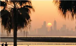  ?? — KUNA ?? KUWAIT: The sun sets behind the Kuwait City skyline.