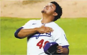  ?? SUE OGROCKI AP ?? Dodgers reliever Brusdar Graterol celebrates after a catch by Cody Bellinger thwarted a home run on Wednesday.