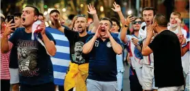  ?? EPA ?? Causing a stir: crowds react as Djokovic is escorted in a car