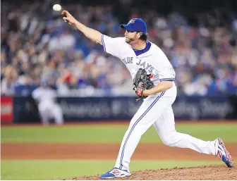  ??  ?? Blue Jays reliever Jason Grilli unloads against the Yankees on Monday. The veteran allowed two late home runs that proved costly for Toronto.