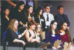  ??  ?? Marjory Stoneman Douglas High School students and their supporters react as they watch the Florida House of Representa­tives vote down a procedural move to take a bill banning assault weapons out of committee and bring it to the floor for a vote.