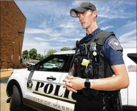  ?? KEVIN WHITLOCK / MASSILLON INDEPENDEN­T ?? Massillon Police Officer Aaron Franklin helped rescue five teens from a culvert, then saved a man who had overdosed.
