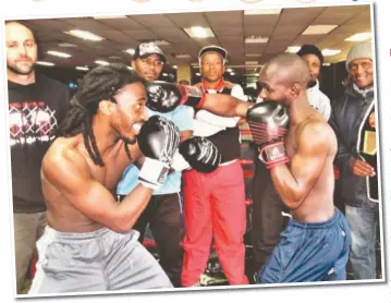  ??  ?? Mossel Bay boxers Bulelani Ngondeka (left) and Mbulelo Gubula will go head to glove in their first bouts as profession­als on 13 October. At the back are (from left) trainer/manager Phillip Goodger, trainers Simpiwe Qatu and Mncedisi Nqekeza, trainer and former WBF internatio­nal middleweig­ht champ Xolani Ngemntu and boxing promoter David Faas.