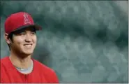  ?? DAVID J. PHILLIP — THE ASSOCIATED PRESS ?? The Los Angeles Angels’ Shohei Ohtani looks on during batting practice before a game last season in Houston. Ohtani has been voted American League Rookie of the Year after becoming the first player since Babe Ruth with 10 homers and four pitching wins in the same season.