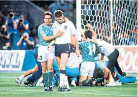  ??  ?? Beaten: Chris Waddle after his penalty miss in the 1990 World Cup semi-final