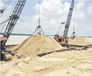  ??  ?? The sand-laden barge seized during the raid.