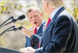  ?? Andrew Harnik Associated Press ?? KING ABDULLAH II of Jordan, left, accompanie­d by President Trump, speaks during a news conference in the Rose Garden of the White House on April 5.