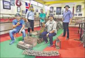  ??  ?? (Above, second from right) Angabam Singh, cofounder of a foundation of history buffs in Manipur. He has been collecting war relics for over 10 years. (Left) The memorial Manipuris built for Japanese soldiers killed in battle at Red Hill, 16 km from...