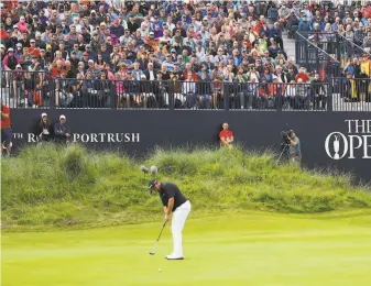  ?? Francois Nel / Getty Images ?? Ireland’s Shane Lowry putts on the 18th green, completing a 30 on the back nine and a thirdround 63 to break away from the pack for a fourshot lead at Royal Portrush.