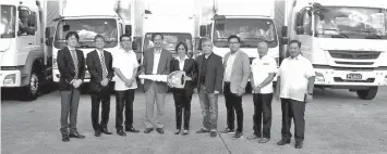  ??  ?? Present at the ceremonial turnover of FUSO trucks to MMI (L-R): Koichiro Ito - MFTBC Int'l Sales Operations SEA; Tomohiro Suzuki - GM, Market Management FUSO SEA; Shigeru Ogura – MMPC EVP Marketing; Mutsuhiro Oshikiri - MMPC President & CEO; Atty....