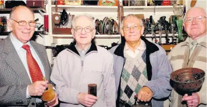  ??  ?? ●●Jack Dalton, Ronnie Lord, Derek Lord and Alan Schofield checking out some of the many relics and memorabili­a held by Whitworth Museum