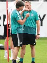  ?? — AFP ?? Germany’s head coach Joachim Loew speaks with goalkeeper trainer Andreas Koepke during a training session.