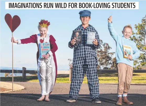  ?? Picture: Nev Madsen. ?? DRESSED TO IMPRESS: Celebratin­g Book Week are Toowoomba Anglican School students (from left) Rose Oldham, Toby Goldthorpe and Charlie Elliott.