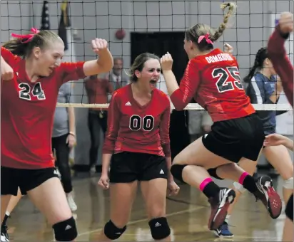  ?? Jayne Kamin-Oncea/For The Signal ?? (Above) Santa Clarita Christian players rejoice after a point in their win over Trinity on Tuesday. (Below) Trinity’s Mary MacAdam attempts a dig.