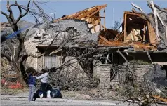  ?? LM OTERO / ASSOCIATED PRESS ?? This house in the Preston Hollow section of Dallas was severely damaged by a tornado that ravaged the area Sunday night.