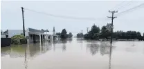  ?? PHOTO: RICHARD EMERSON ?? Flooding in Snow Ave, Middlemarc­h, on January 2.