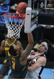  ?? DARRON CUMMINGS - THE ASSOCIATED PRESS ?? Baylor guard Mark Vital (11) shoots over Gonzaga forward Corey Kispert (24) during the second half of the championsh­ip game in the men’s Final Four NCAA college basketball tournament, Monday, April 5, 2021, at Lucas Oil Stadium in Indianapol­is.