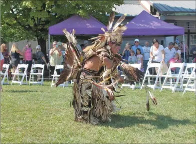  ?? LAUREN HALLIGAN - MEDIANEWS GROUP FILE ?? A performer wears face paint and an outfit decorated with feathers as he dances at the 2018 Saratoga Native American Festival.