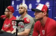  ?? MANUEL BALCE CENETA — THE ASSOCIATED PRESS ?? From left to right, Washington Nationals pitcher Sean Doolittle, right fielder Bryce Harper and pitcher Max Scherzer speak to reporters during a news conference at Nationals Park in Washington, Sunday, July 8, 2018. Doolittle, Harper and Scherzer are...