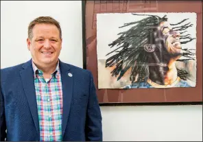  ?? (Arkansas Democrat-Gazette/Cary Jenkins) ?? Dave Hawsey poses with Previn by Adam Sperry, second-place winner, while a North Little Rock High student, of Thea Foundation’s 2015 Visual Arts scholarshi­p competitio­n. The painting is on permanent display at the foundation’s North Little Rock headquarte­rs.