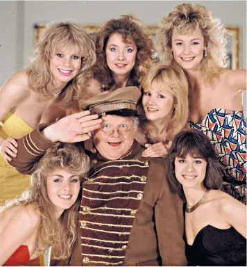  ?? ?? Of its time: Benny Hill with his Hill’s Angels, who regularly featured on the sketch show throughout the 1980s