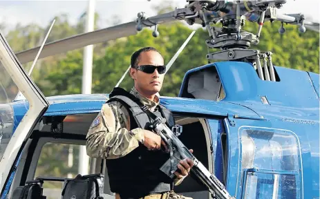  ?? Reuters ?? Trigger happy: Police official Oscar Perez poses for photograph­s during an event of the Body of Scientific, Penal and Criminal Investigat­ion in Caracas, Venezuela in 2015. Perez is alleged to be responsibl­e for firing shots and lobbing grenades on the...