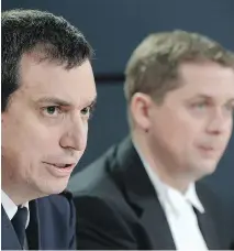  ?? ADRIAN WYLD/THE CANADIAN PRESS ?? Speaker of the House of Commons Andrew Scheer, right, and RCMP assistant commission­er Gilles Michaud at a news conference Wednesday releasing censored versions of police reports into last October’s attack on Parliament Hill.