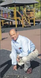  ??  ?? Councillor Reg Harrington, pictured in 2003, pointing out damage at a children’s playground