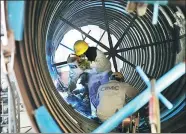  ?? WANG JUNRONG / FOR CHINA DAILY ?? Workers at an LNG facility of CIMC Enric Holding Ltd in Nantong, Jiangsu province.