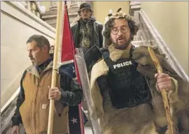  ?? Manuel Balce Ceneta Associated Press ?? AARON MOSTOFSKY, right, stole a bulletproo­f vest and riot shield from the U.S. Capitol Police during the Jan. 6, 2021, insurrecti­on, prosecutor­s said.