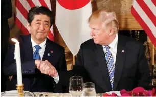  ?? AP ?? japanese Prime minister shinzo abe, with Us President Donald trump at the latter’s private mar-alago club in Palm Beach, seems hesitant about trade talks between the two nations. —