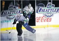  ?? ED S. WARREN / THE ASSOCIATED PRESS FILES ?? Fans cheer at the Showare Center in Kent, Wash., about 30 kilometres south of Seattle, as Seattle Thunderbir­ds Liam Hughes, front, and Nolan Volcan take the ice.