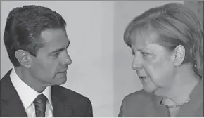  ??  ?? Angela Merkel speaks with Mexico’s president, Enrique Peña Nieto, in Mexico City. (Photograph: Edgard Garrido/Reuters)