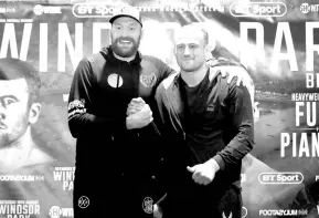  ??  ?? Tyson Fury and Francesco Pianeta pose for a photograph during a press conference, ahead of their fight in Belfast on Saturday. — Reuters photo