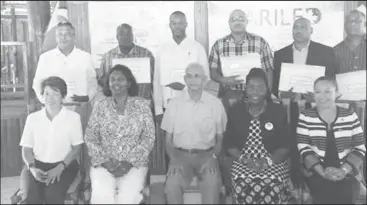  ??  ?? From left seated: Marion Villanueva, Project Director, CARILED; Sharmini Poulin, Chargé d’ Affaires, High Commission of Canada; Ronald Bulkan, Minister of Communitie­s and junior ministers Valerie Patterson and Dawn HastingsWi­lliams; pose with...