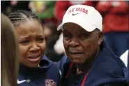  ?? JOSIE LEPE/THE ASSOCIATED PRESS ?? Mississipp­i head coach Yolett McPhee-McCuin gets emotional with her father, Gladstone McPhee, right, after Sunday’s win over Stanford in Stanford, Calif.